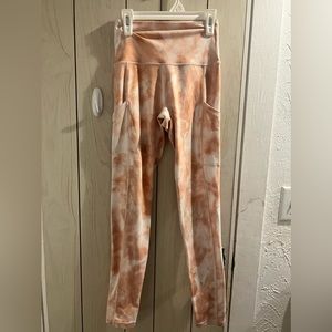 Tie-dye pink and white criss cross mid rise leggings